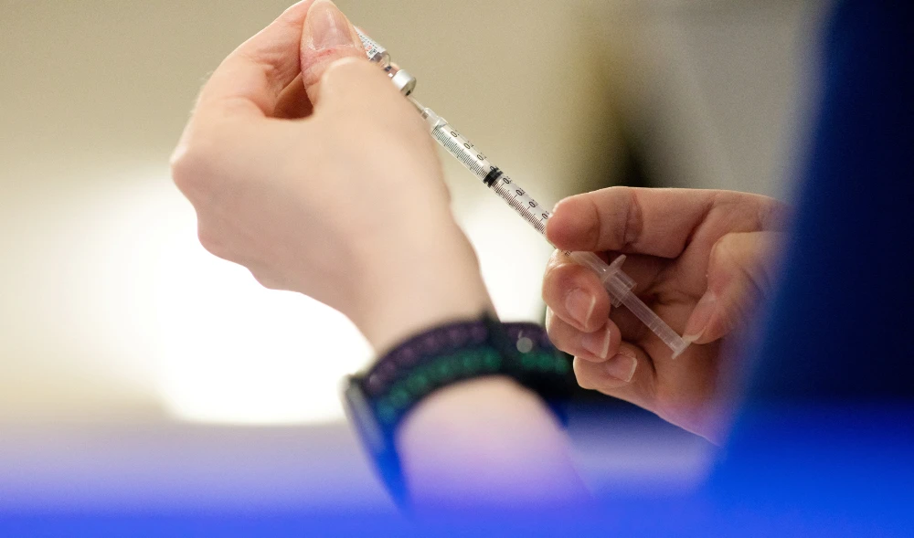 A nurse fills up syringes with the coronavirus disease (COVID-19) vaccines. (REUTERS)