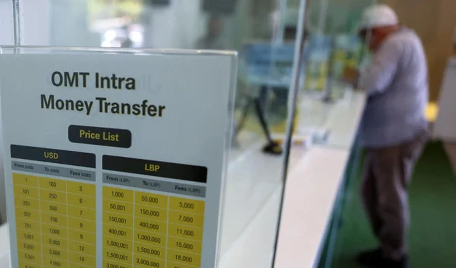 A man awaits his cash at a money transfer office in Lebanon's capital Beirut, on July 27, 2022. (AFP)