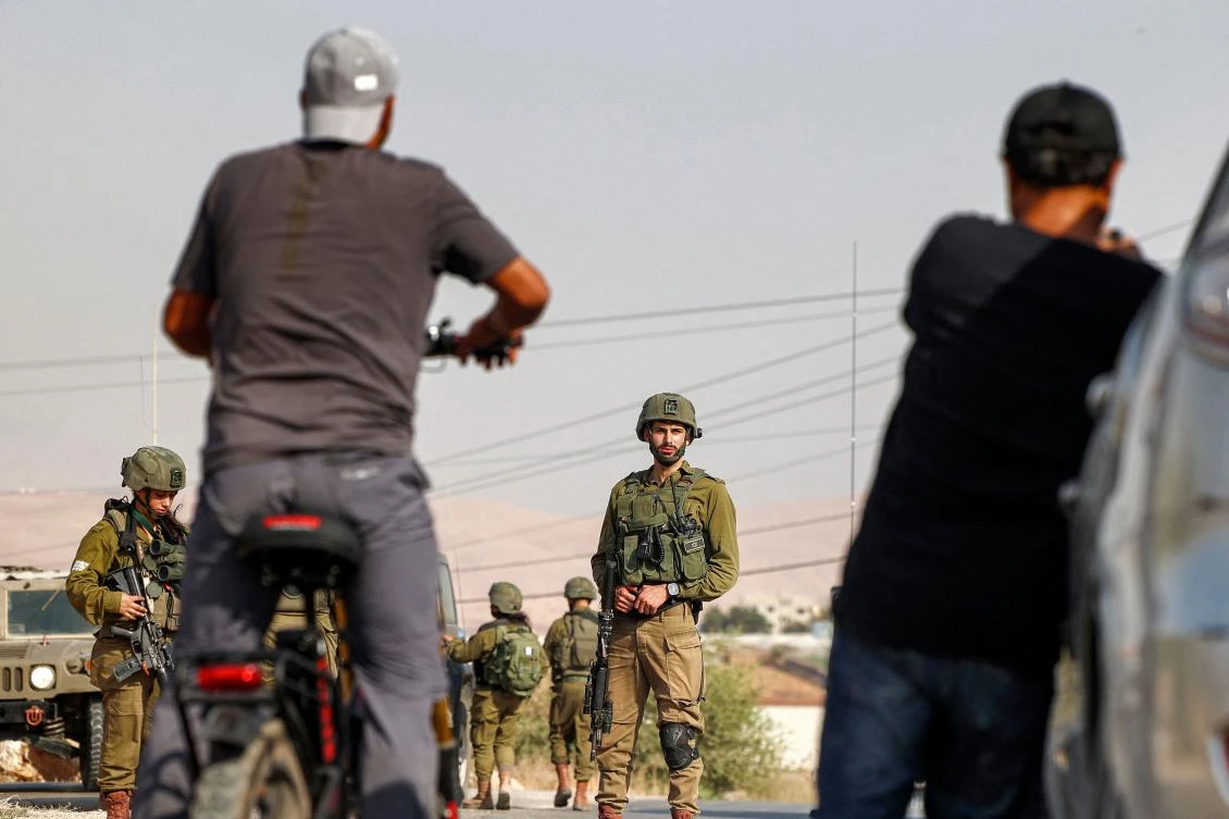 The policy imposes rules on foreigners who marry Palestinians or who come to the West Bank to work, volunteer, study or teach, but the rules don't apply to Israel's visitors. (AFP)