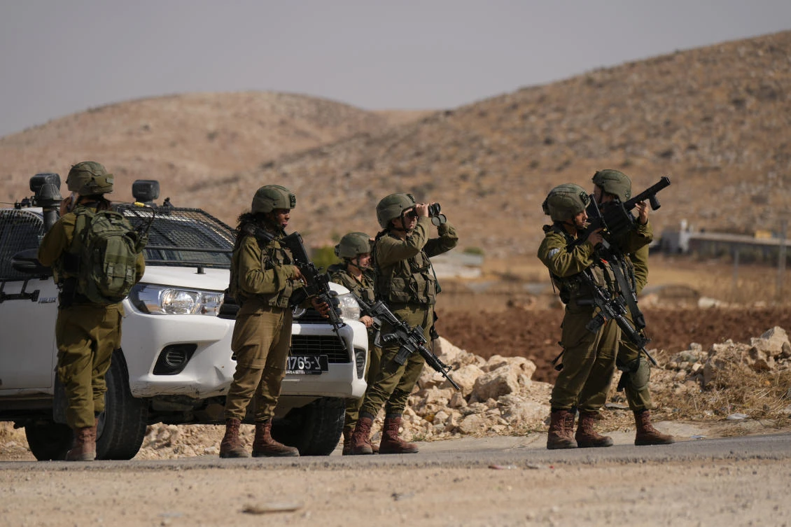 Israel has been conducting near-daily arrest raids in the West Bank for months, which were prompted by a spate of deadly attacks against Israelis earlier this year that killed 19 people. (AP)