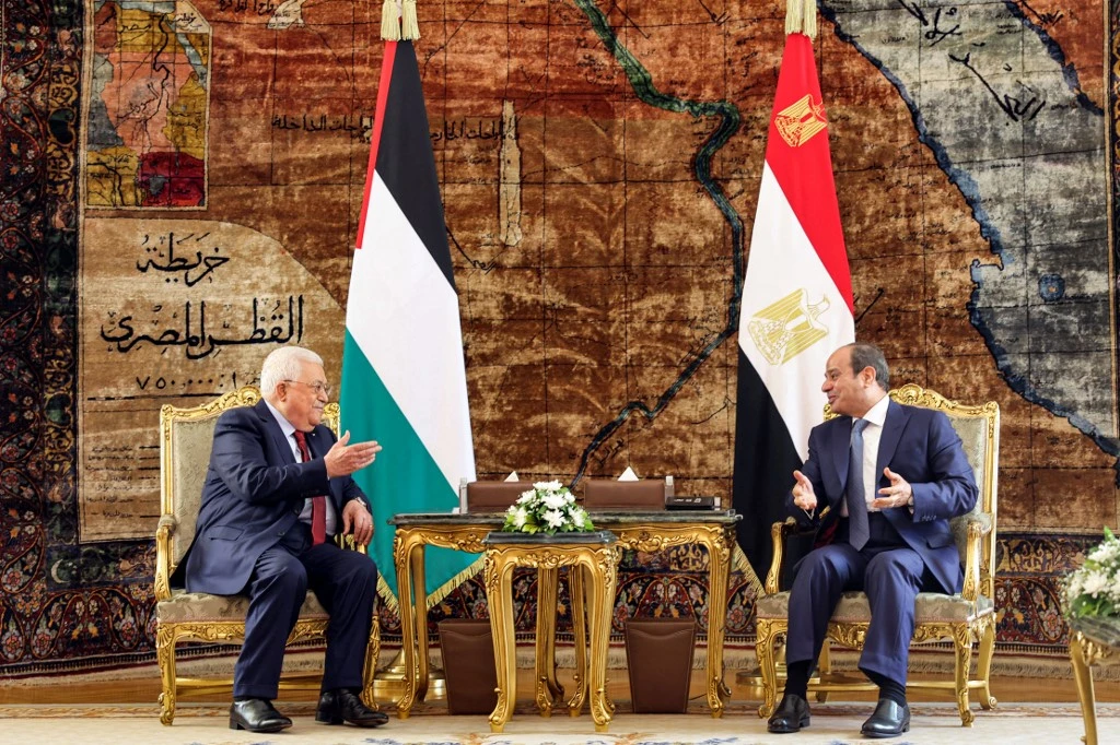 Egypt’s President Abdel Fattah El-Sisi, right, with his Palestinian counterpart Mahmoud Abbas in Cairo on Sept. 6, 2022. (Palestinian Authority press office via AFP)