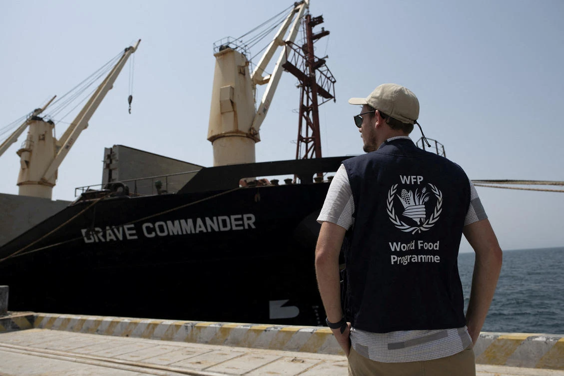 A WFP staff looks on as the MV Brave Commander carrying wheat grain from Yuzhny Port in Ukraine to the Horn of Africa docks at port of Djibouti on August 30, 2022. (Reuters)