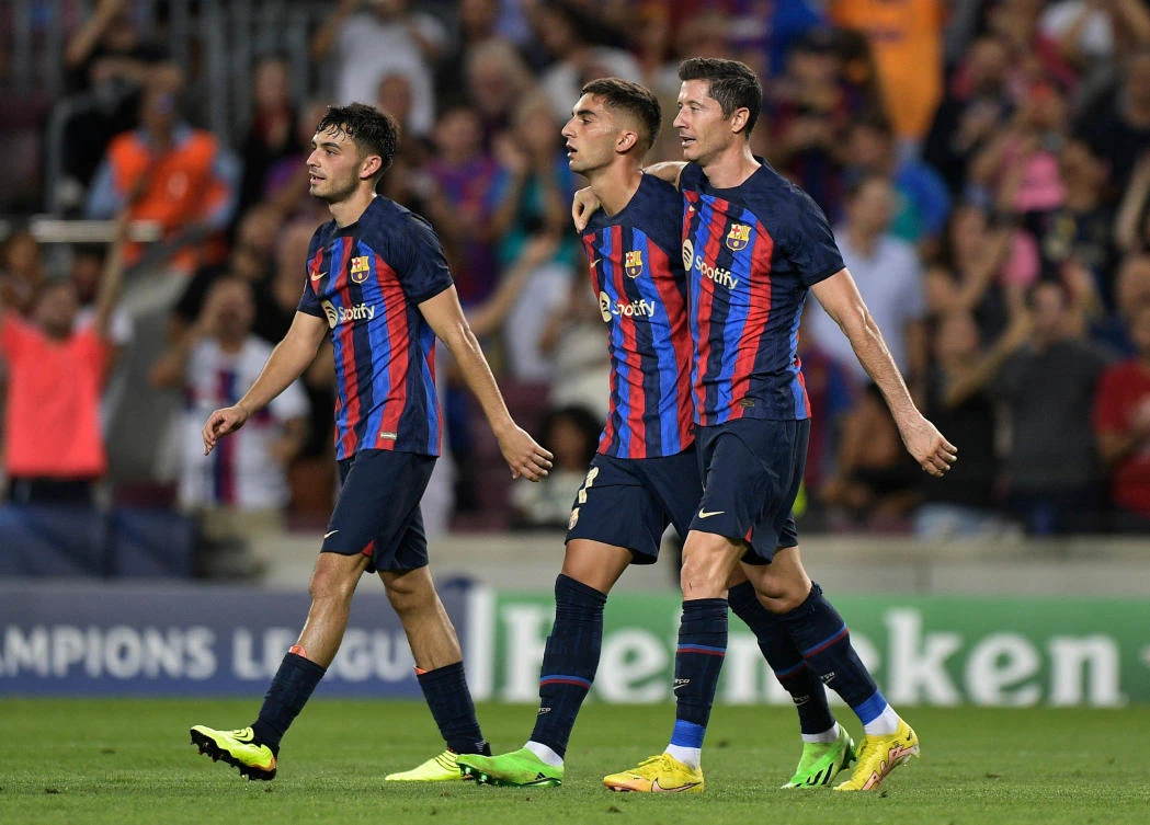 FC Barcelona’s Robert Lewandowski celebrates with Pedri and Ferran Torres after their Champions League match against Viktoria Plzen at the Camp Nou, Barcelona on Wednesday. (Reuters)