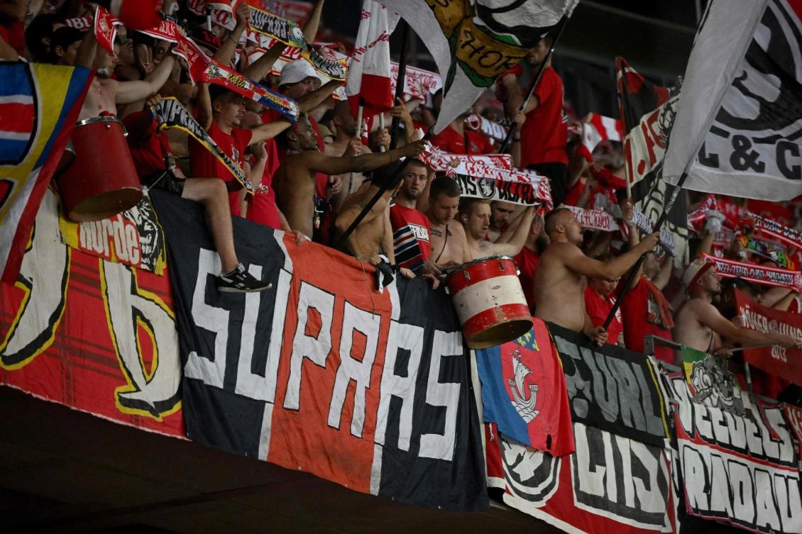 A PSG’s fans banner reading “Supras” is displayed among Cologne’s fans during the UEFA Europa Conference League football match between Nice and FC Cologne at the Allianz Riviera in Nice, on Thursday. (AFP)