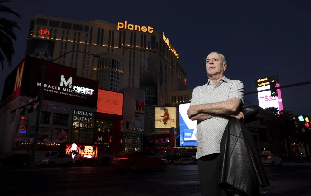 Jeff German, host of Mobbed Up, poses with Planet Hollywood in the background on the Strip in Las Vegas in 2021. (AP)