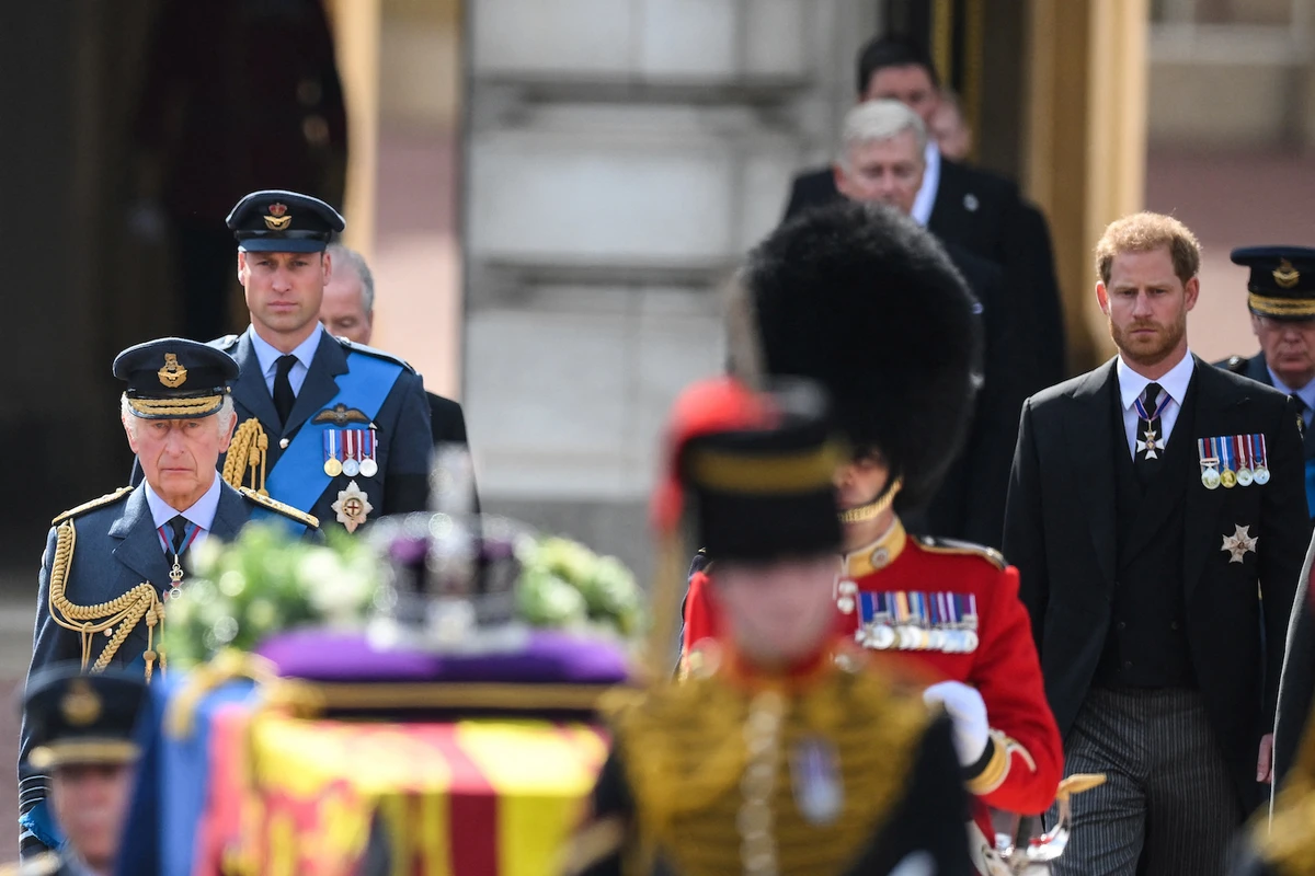 Britain's King Charles III, Britain's Prince William, Prince of Wales and Britain's Prince Harry, Duke of Sussex walk behind the coffin of Queen Elizabeth II. (Reuters)