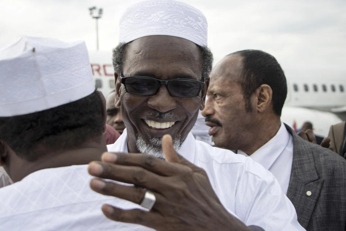Timan Erdimi, leader of the rebel Union of Resistance Forces (UFR), greets his relatives who came to welcome him as he arrives at the N'Djamena International Airport in N'Djamena, Chad, on August 18, 2022, after 17 years in exile. (File/AFP)