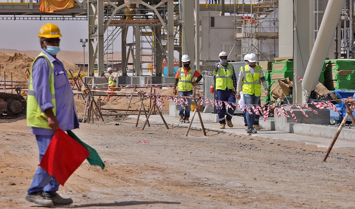 Workers are pictured next to a waste management facility under construction at the Bee'ah company in the Gulf emirate of Sharjah, on September 2, 2021. (AFP/File)