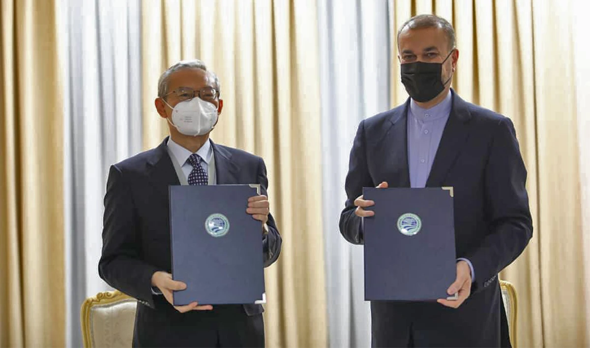 Iran's Foreign minister Hossein Amirabdollahian (right) poses for a picture after signing a memorandum of obligations to join the Shanghai Cooperation Organization (SCO) in Samarkand, Uzbekistan, on September 15, 2022. (@IRIMFA_EN/Twitter)