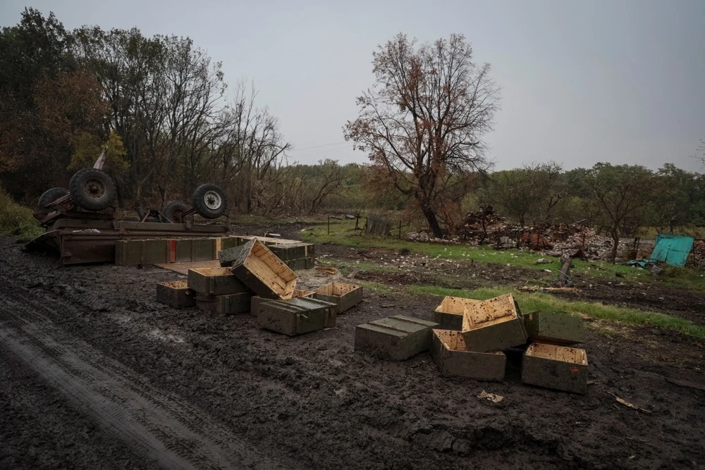 A view shows empty ammunition boxes near destroyed house, amid Russia's attack on Ukraine, in the village of Nova Husarivka. (Reuters)