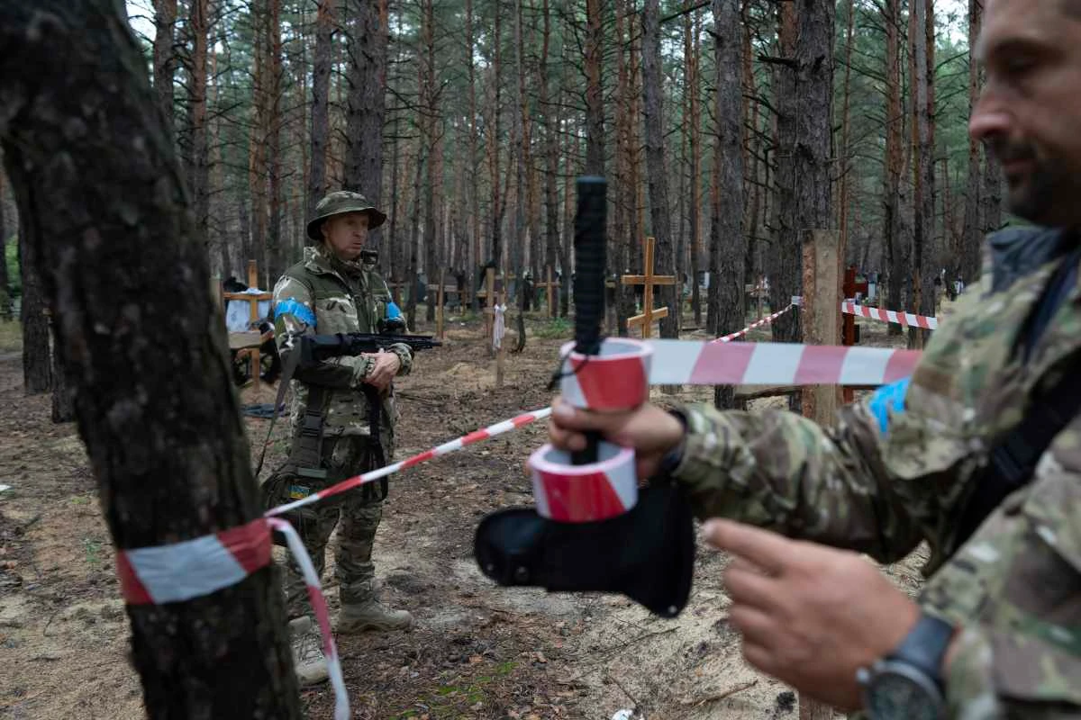 Ukraine says mass grave found in Izium where Russians were ousted days ago