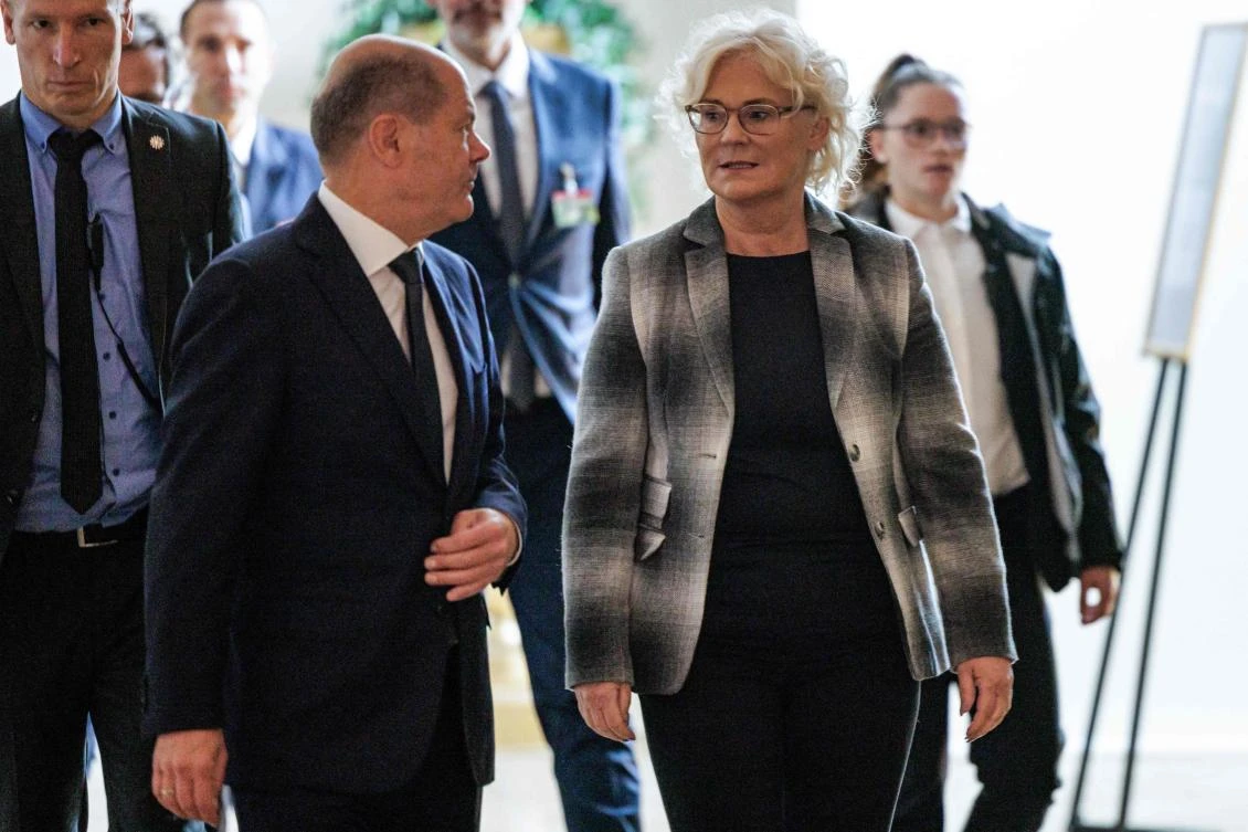 German Chancellor Olaf Scholz and German Defense Minister Christine Lambrecht arrive for a press conference on the sidelines of a conference of the German Armed Forces Bundeswehr in Berlin on Friday. (AFP)