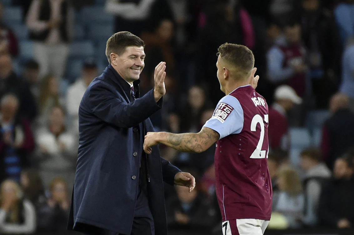 Aston Villa’s head coach Steven Gerrard celebrates with Lucas Digne at the end of their Premier League match against Southampton at Villa Park in Birmingham, on Friday. (AP)