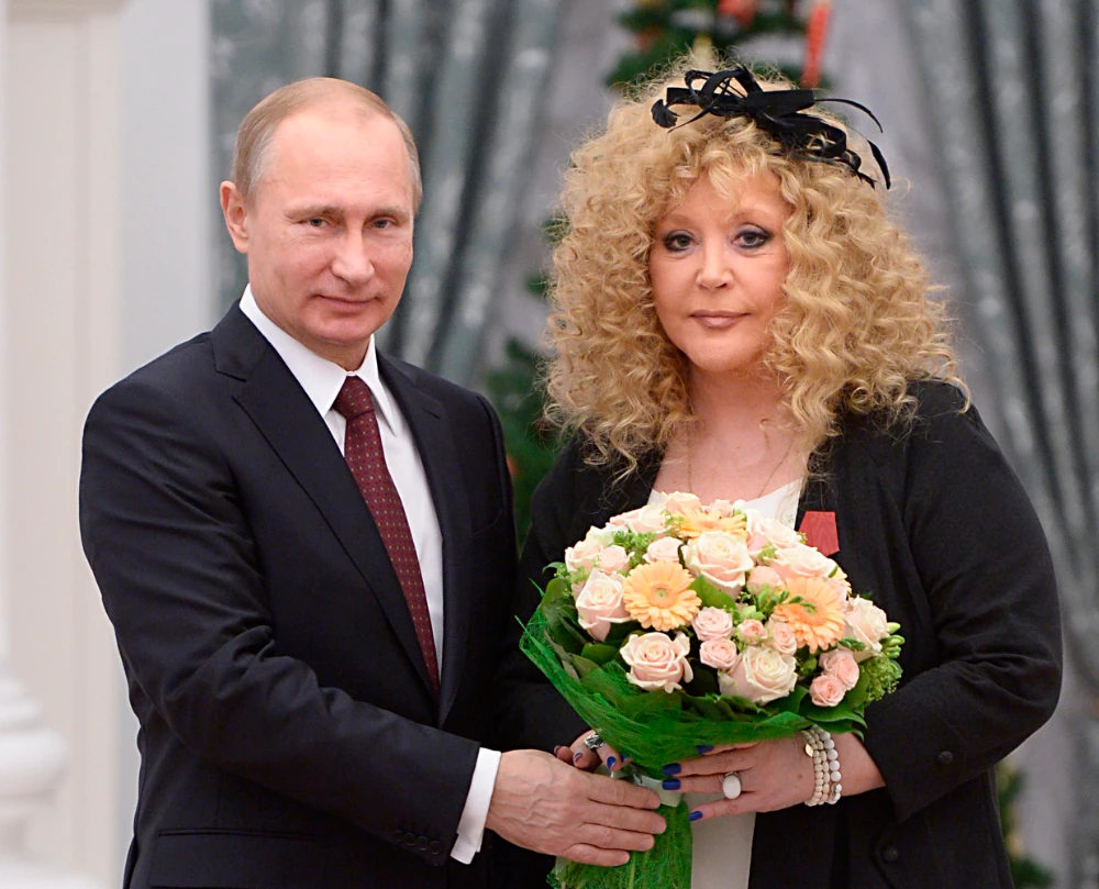 Russian President Vladimir Putin, left, and Russian pop singer Alla Pugacheva pose for a photo during an awards ceremony in Moscow, Russia, Dec. 22, 2014. (AP)