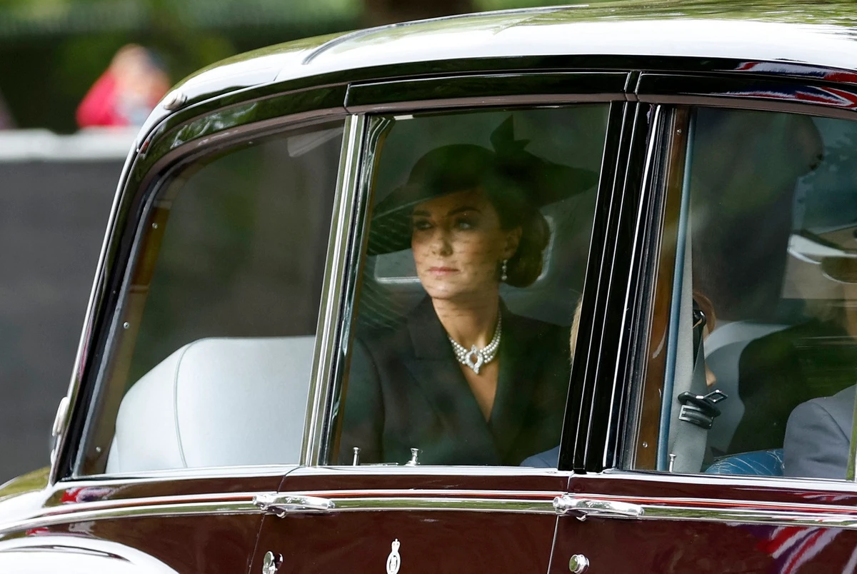 Wearing traditional all-black attire, she paid tribute to the queen by opting for pearls that belonged to the queen. (AFP)