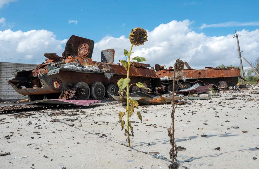 Destroyed military vehicles and equipment are seen in the village of Husarivka, not far from the city of Balakliya, Kharkiv region, on September 18, 2022, recently recaptured by the Ukrainian army following the retreat of Russian troops. (AFP)