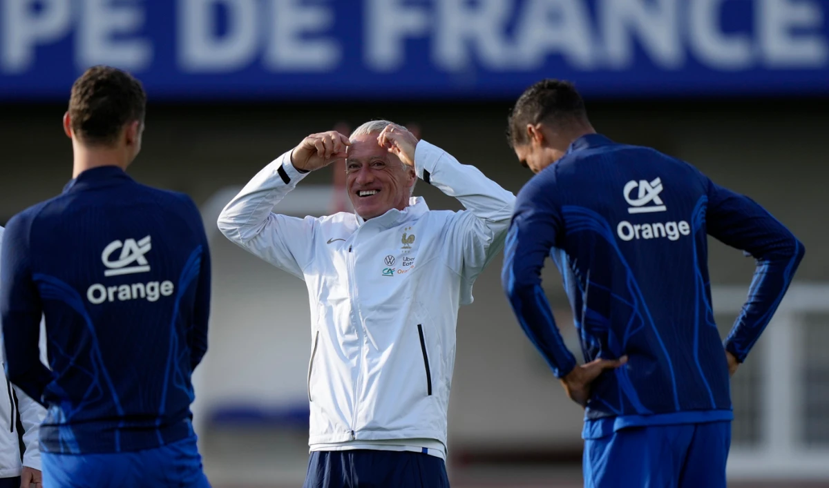 France's head coach Didier Deschamps, center, attends a training session of the French national soccer team at Clairefontaine training center, south of Paris, Monday. (AP)
