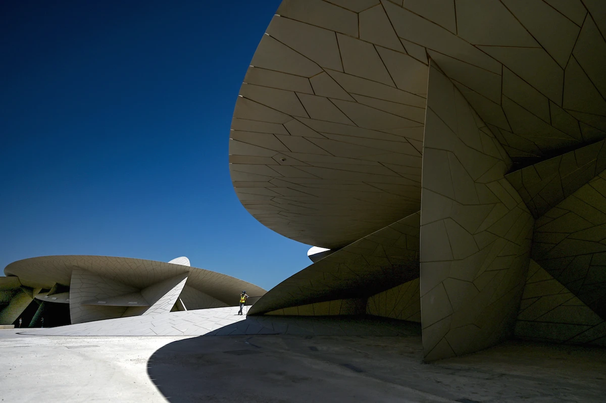 People visit the National Museum of Qatar, designed by architect Jean Nouvel, in the capital Doha, on March 31, 2022. (AFP)