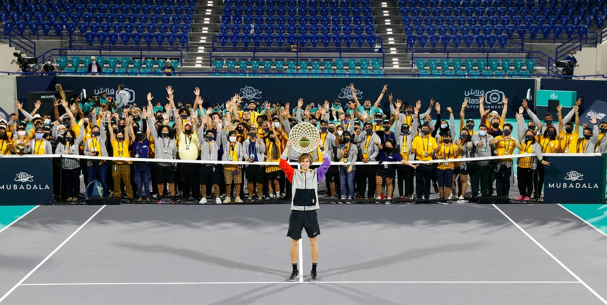 Winner of last year’s Mubadala World Tennis Championship Andrey Rublev with the tournament’s volunteers. (MWTC)