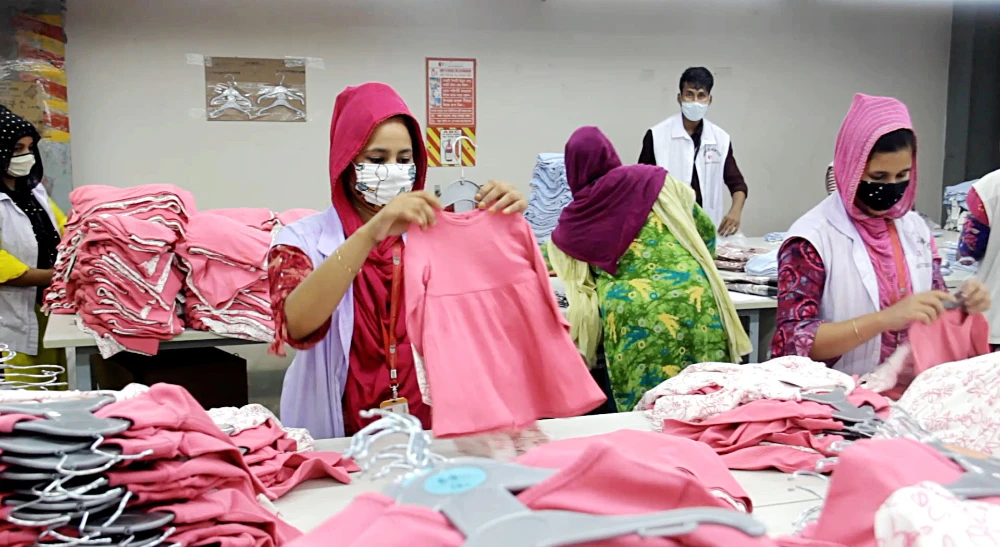 Bangladeshi garment factory workers sort export quality apparel in Dhaka. The garment industry makes up more than 80 percent of Bangladesh exports. (AN photo)