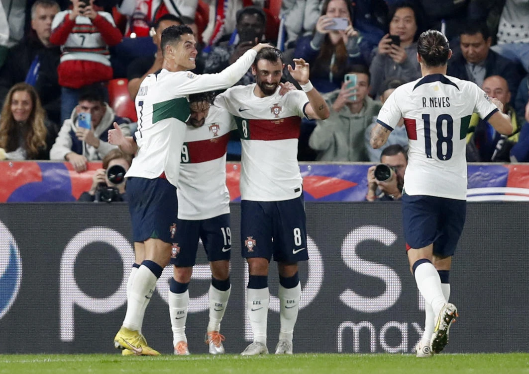 Portugal’s Bruno Fernandes celebrates scoring their second goal with Mario Rui and Cristiano Ronaldo during their UEFA Nations League match against Czech Republic at Eden Arena, Prague on Saturday. (Reuters)