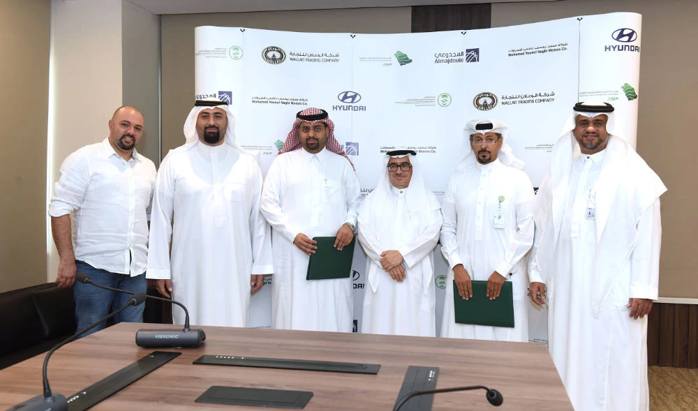 Senior management officials from both sides at the partnership signing ceremony.