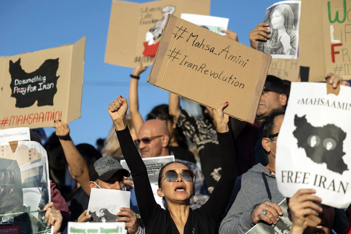 Protesters shout slogans during a protest against the death of Iranian Mahsa Amini, at central Syntagma square, in Athens. (AP)