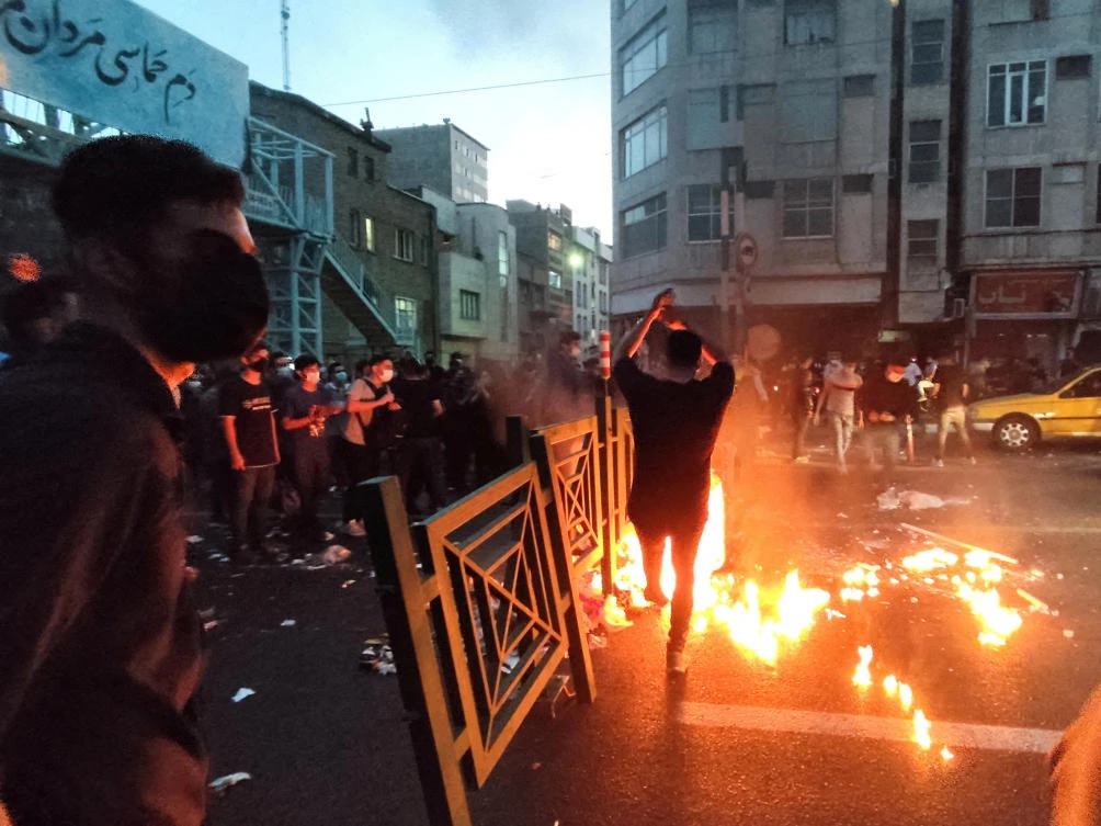 People light a fire during a protest over the death of Mahsa Amini, a woman who died after being arrested by the Islamic republic's "morality police", in Tehran, Iran September 21, 2022. (File/Reuters)