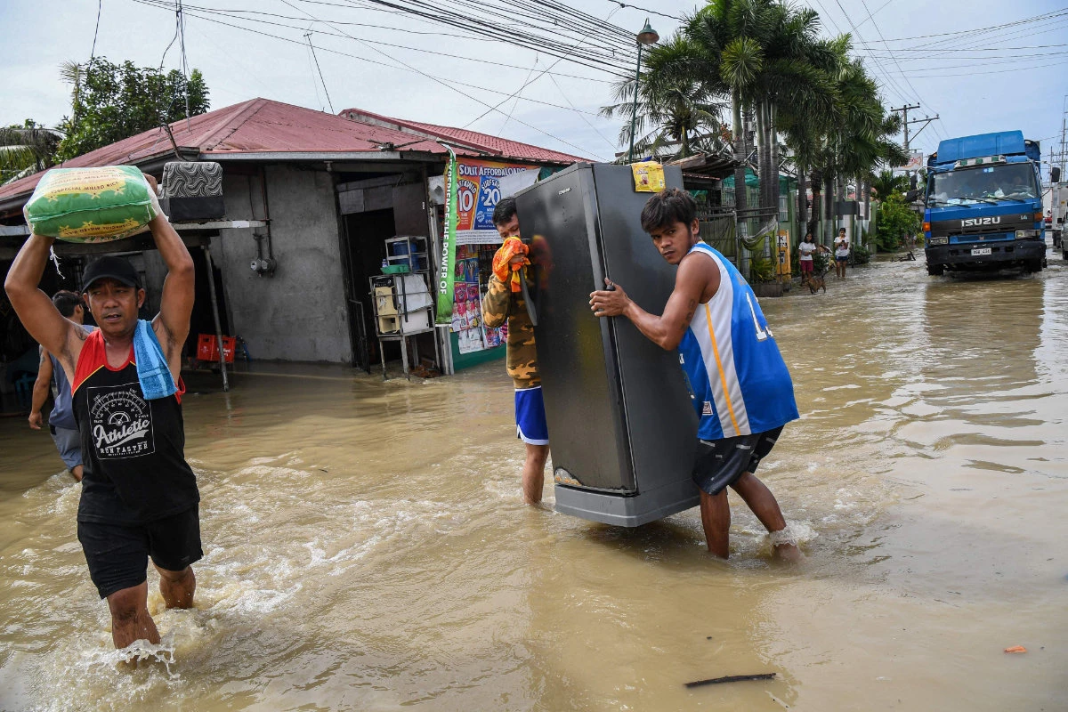 Power cuts, heavy floods in northern Philippines after powerful typhoon