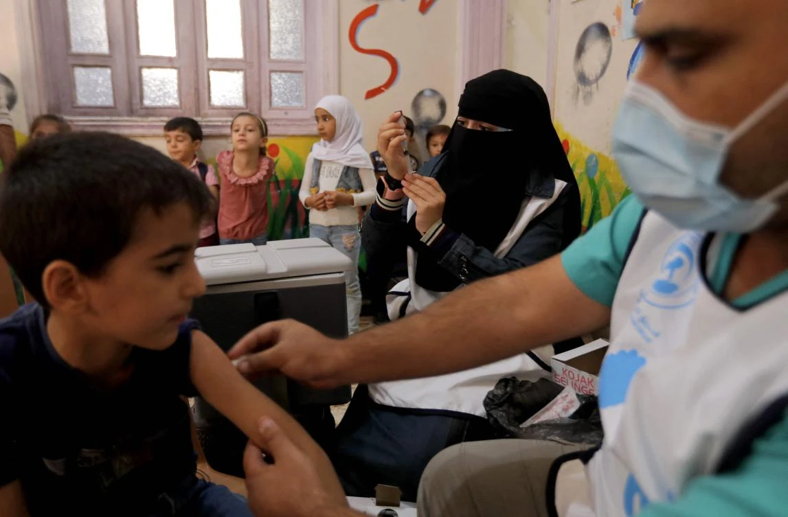 Syrian children get vaccinated at a health centre in the opposition-held city of al-Bab, on the border with Turkey, in Syria's northern Aleppo province, on September 25. (File/AFP)