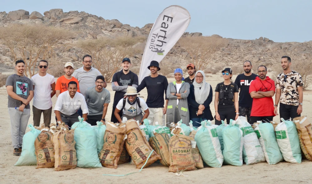 Volunteers collected over 4,000 plastic bottles, 1,000 cans, and glass shards collected from hiking trails in Asfan. (Supplied)