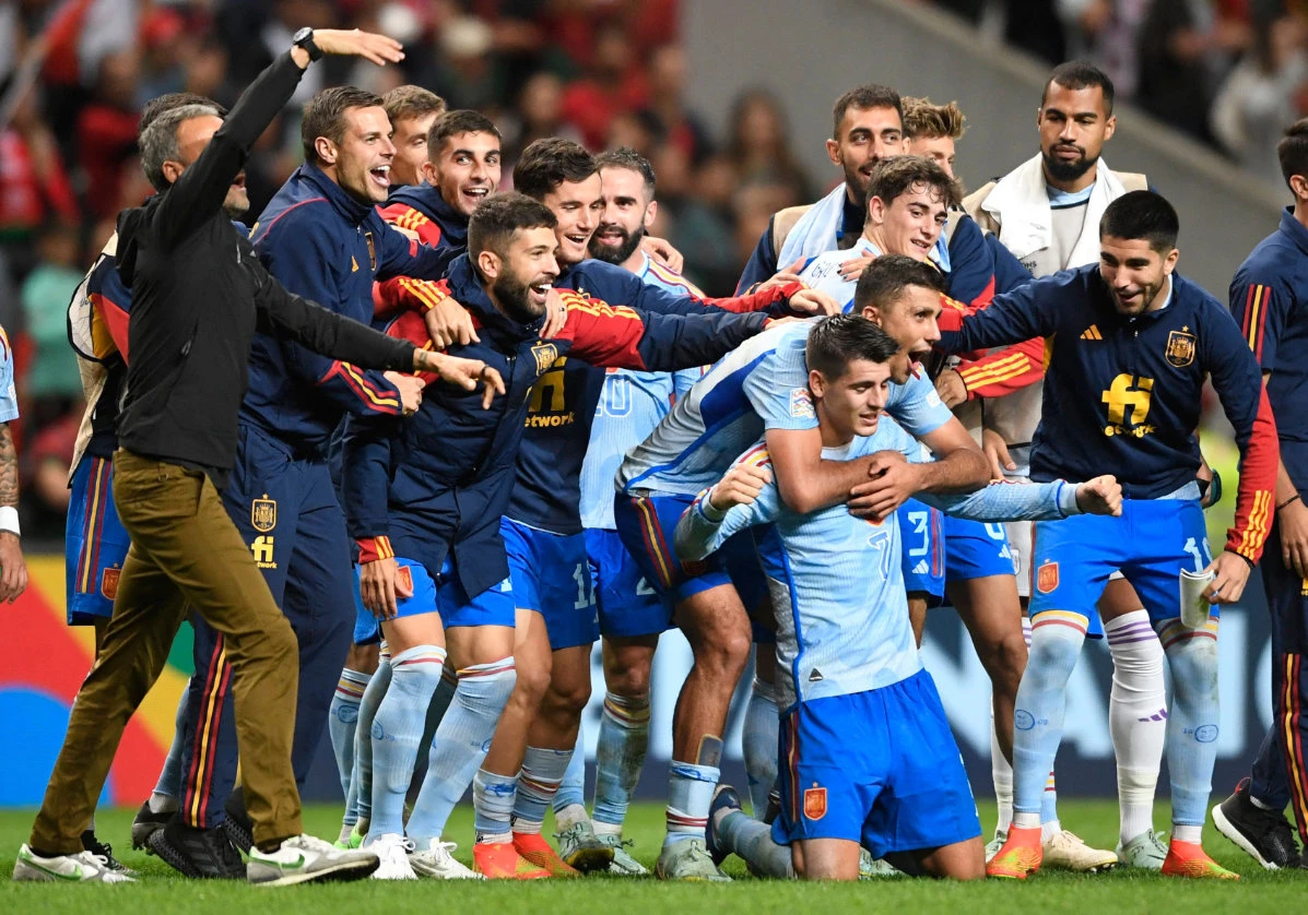 Spain's forward Alvaro Morata (C, R) celebrates with teammates after their victory in the UEFA Nations League, league A, group 2 match against Portugal. (AFP)