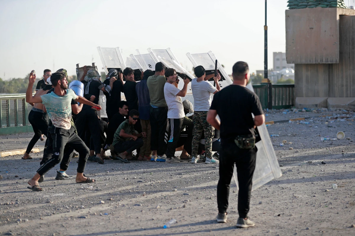 Iraqi supporters of Shiite Muslim cleric Moqtada clash with security forces in Tahrir Square in the centre of Iraq's capital Baghdad on September 28, 2022 ahead of a parliament session. (File/AFP)