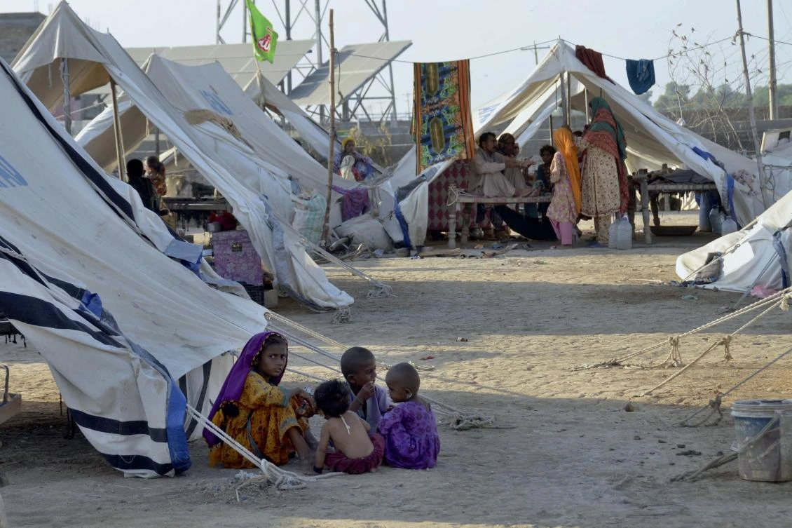 Children play outside their tent at a relief camp, in Jaffarabad, a district in the southwestern Baluchistan province, Pakistan, on Thursday. (AP)