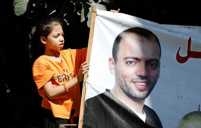 Khalil Awawdeh’s daughter at the family home in Idhna, near Hebron, in the Israeli-occupied West Bank, Aug. 23, 2022. (Reuters)