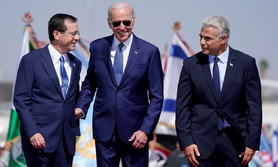 Joe Biden, center, Yair Lapid, right, and Israeli President Isaac Herzog at Ben Gurion Airport, Lod, July 13, 2022. (AP Photo)
