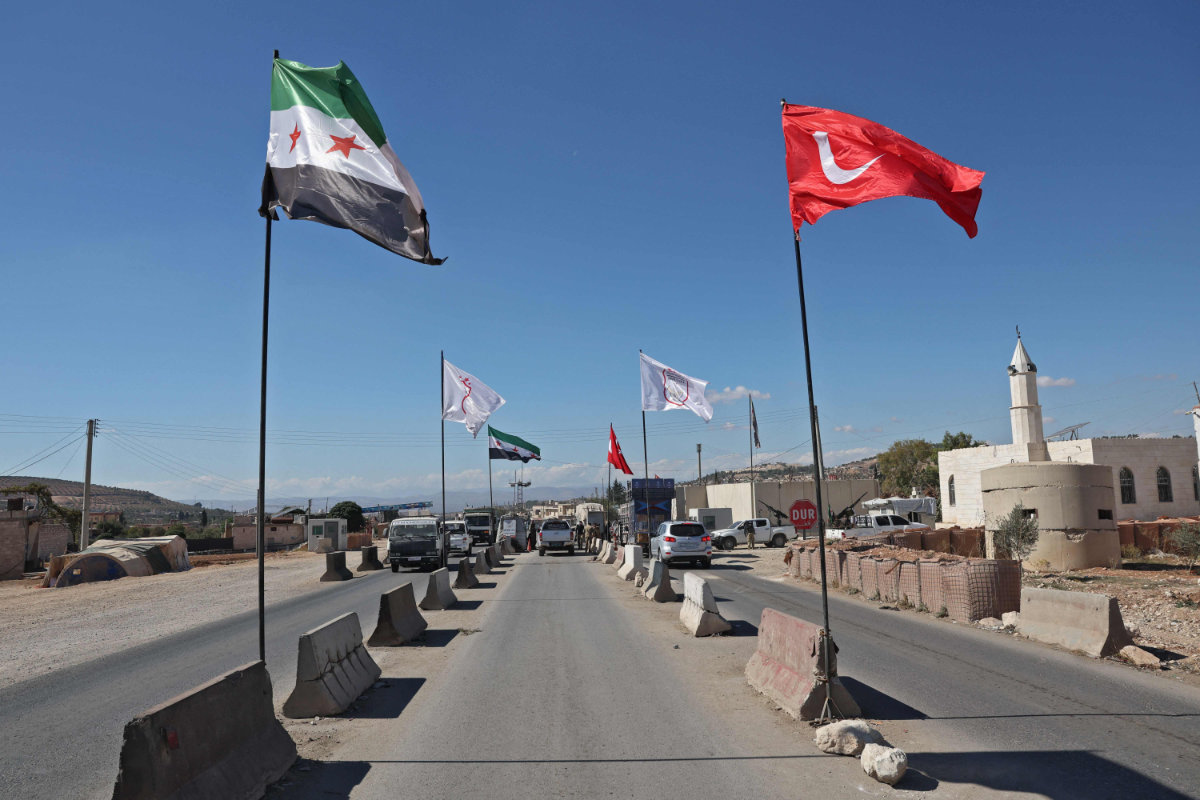 Turkish-backed Free Syrian Army fighters man a checkpoint on the outskirts of the Syrian town of Afrin on Oct. 19, 2022. (AFP)
