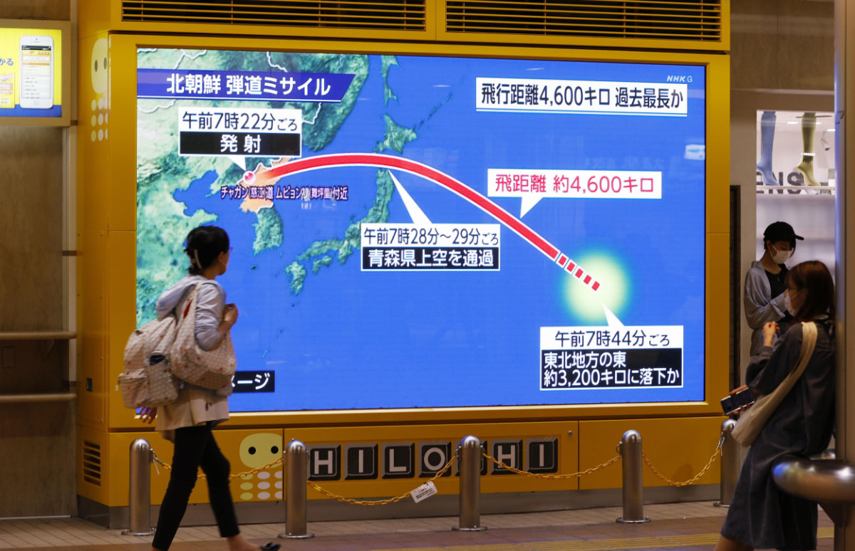 A huge monitor shows a North Korean ballistic missile flied over northern Japan on Oct. 4, 2022.(Kyodo News via AP)