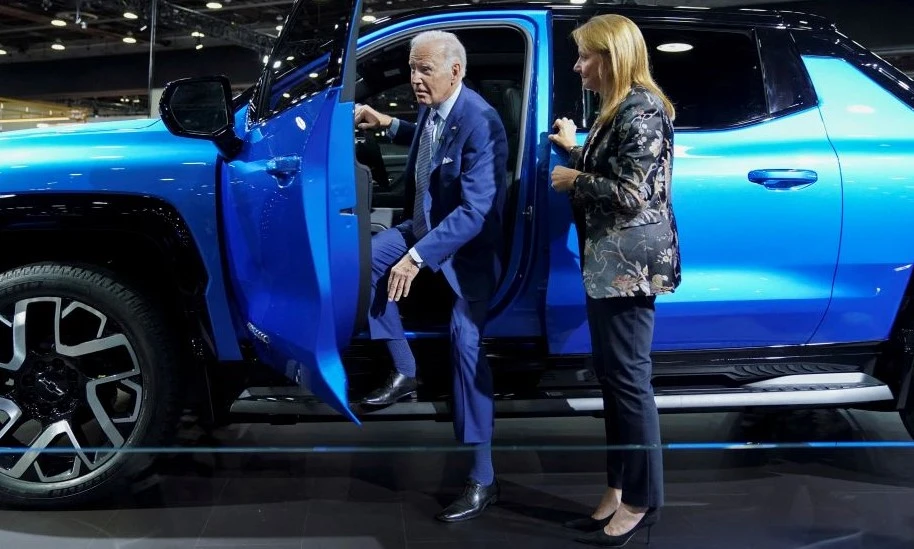 Joe Biden steps out of a Chevrolet Silverado EV pickup truck at the Detroit Auto Show, Michigan, US, Sept. 14, 2022. (Reuters)