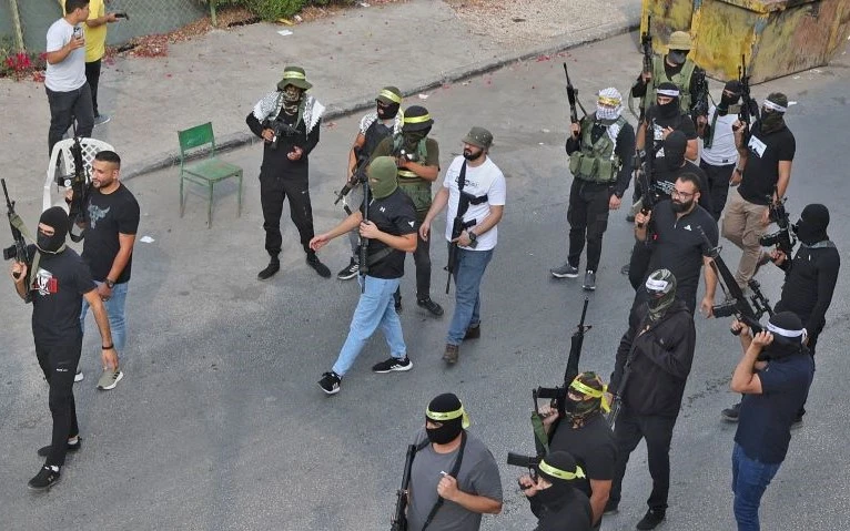 Armed Palestinians at the funeral of Dr Abdullah Al-Ahmad, Jenin, occupied West Bank, Oct. 14, 2022. (AFP)