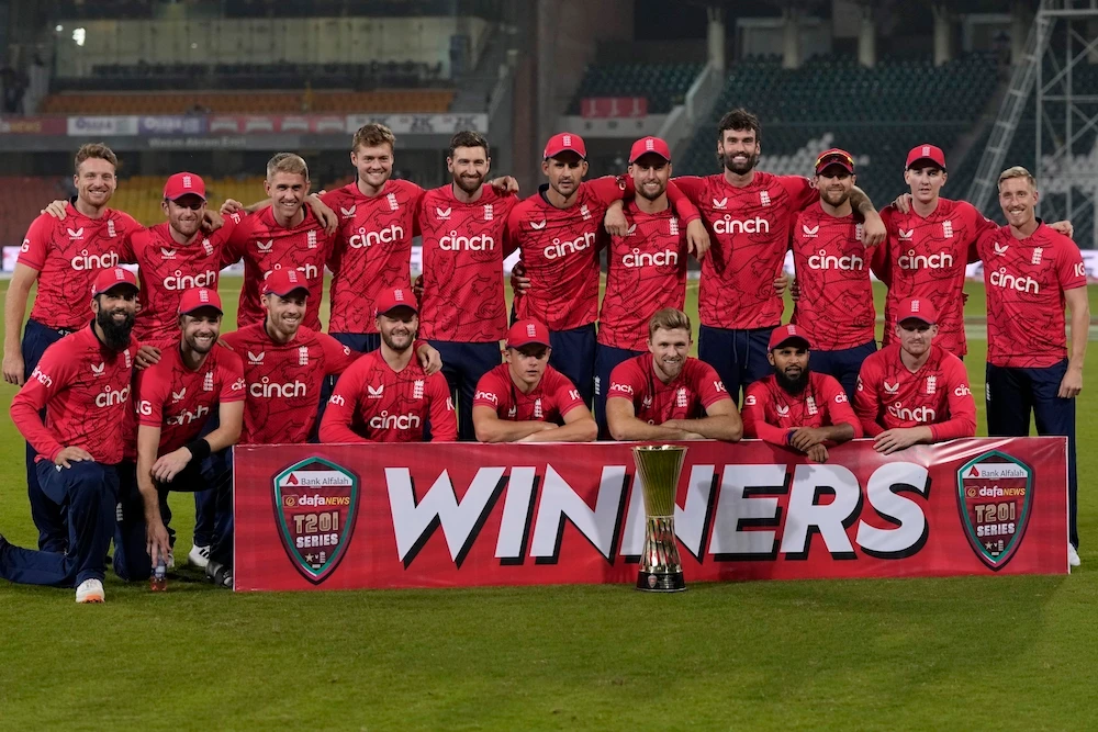 England's players pose for photograph with the trophy at the end of the seventh Twenty20 cricket match between Pakistan and England in Lahore Sunday. (AP)