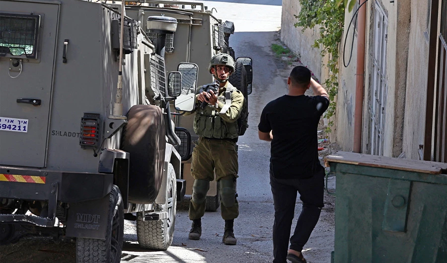 Israeli security forces search for suspects in the village of Salem, east of Nablus, on October 2, 2022. (AFP)