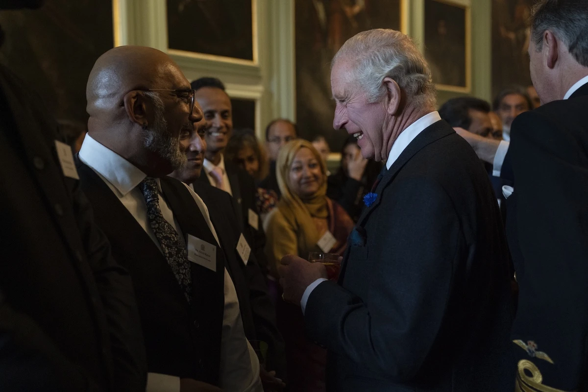 King Charles III and his wife Camilla, the queen consort, talk to guests of South Asian heritage at the Palace of Holyroodhouse on Monday. (@RoyalFamily)