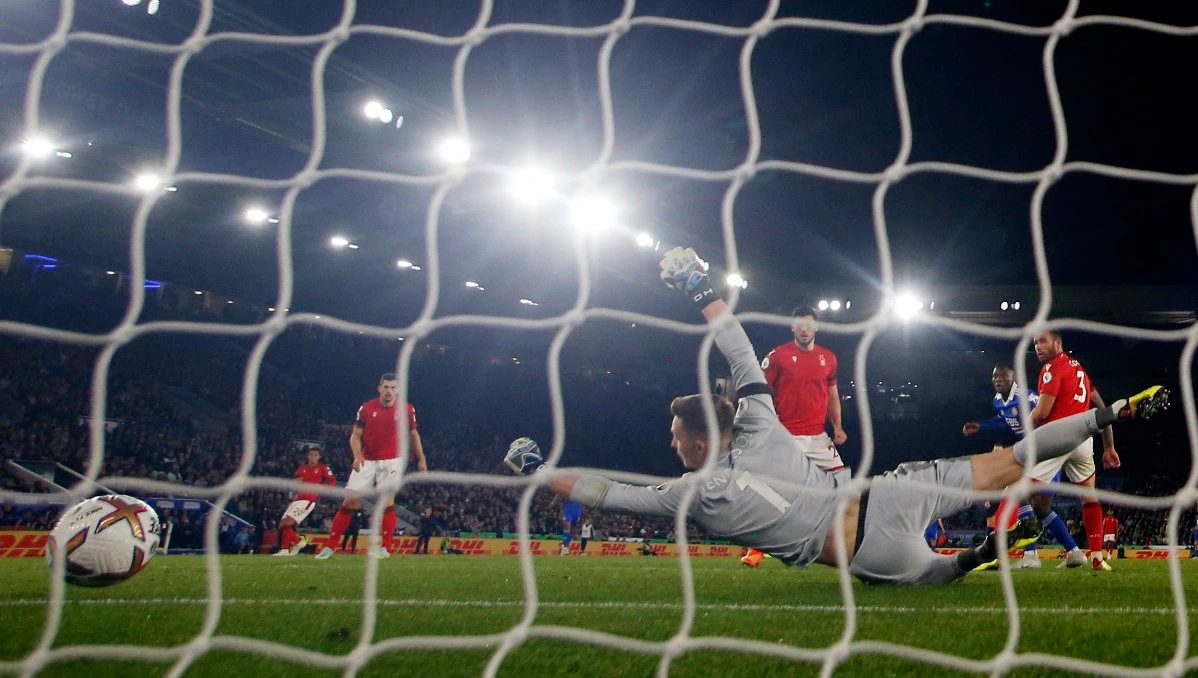 Leicester City's Patson Daka scores their fourth goal past Nottingham Forest's Dean Henderson during their Premier League match on Monday. (Reuters)
