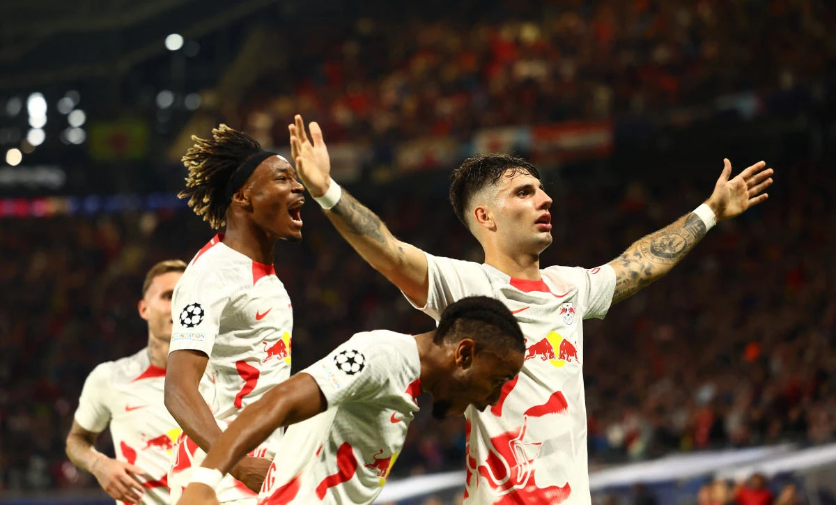 RB Leipzig’s Dominik Szoboszlai celebrates scoring their second goal with Mohamed Simakan and Christopher Nkunku before it was later disallowed during their Champions League match against Celtic at Red Bull Arena, Leipzig on Wednesday. (Reuters)