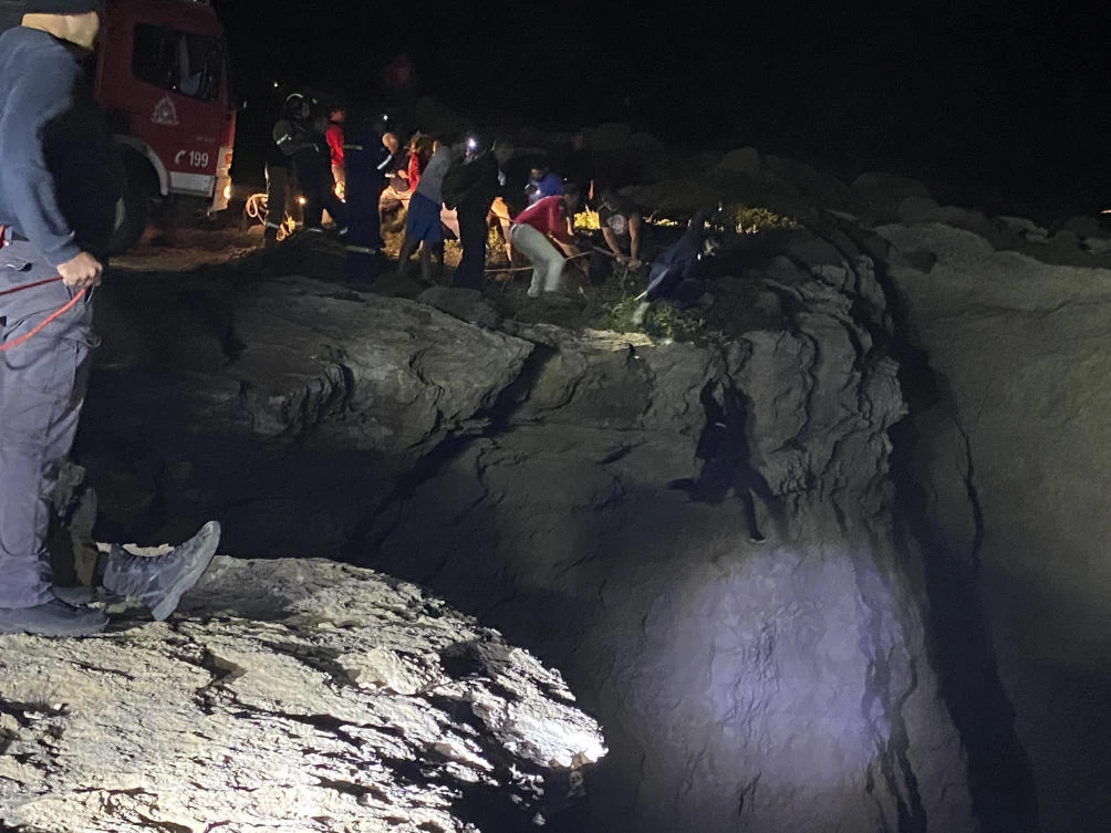 Five people were rescued and three had been located on a rocky outcrop near the site of the sinking. (kythera.news via AP)