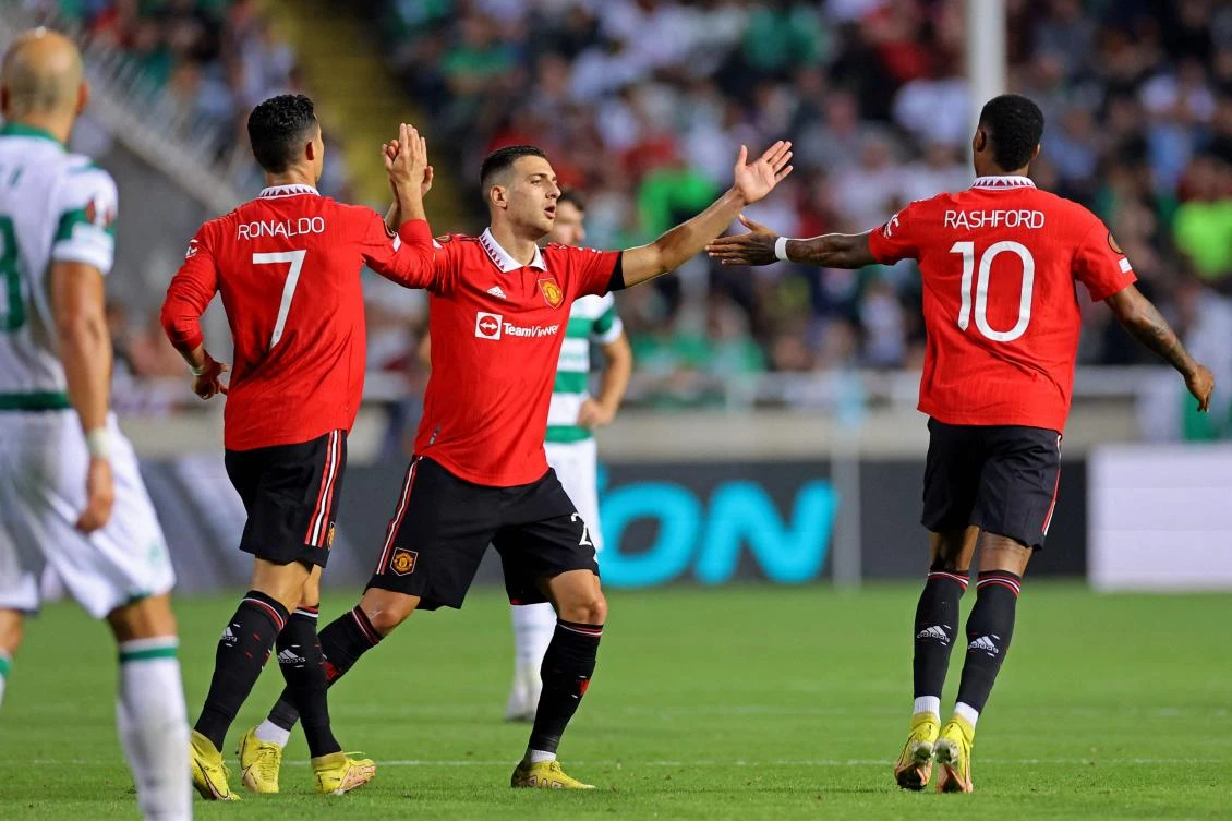 Manchester United’s Portuguese players Cristiano Ronaldo and Diogo Dalot and English striker Marcus Rashford celebrate after a goal during their UEFA Europa League match against Cyprus’ Omonia Nicosia at GSP stadium in Nicosia on Thursday. (AFP)