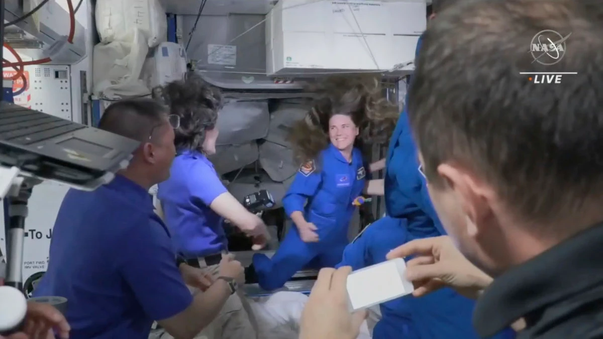 In this image from video made available by NASA, Russian Cosmonaut Anna Kikina enters the International Space Station from a SpaceX Crew Dragon capsule on Oct. 6, 2022. (NASA via AP)