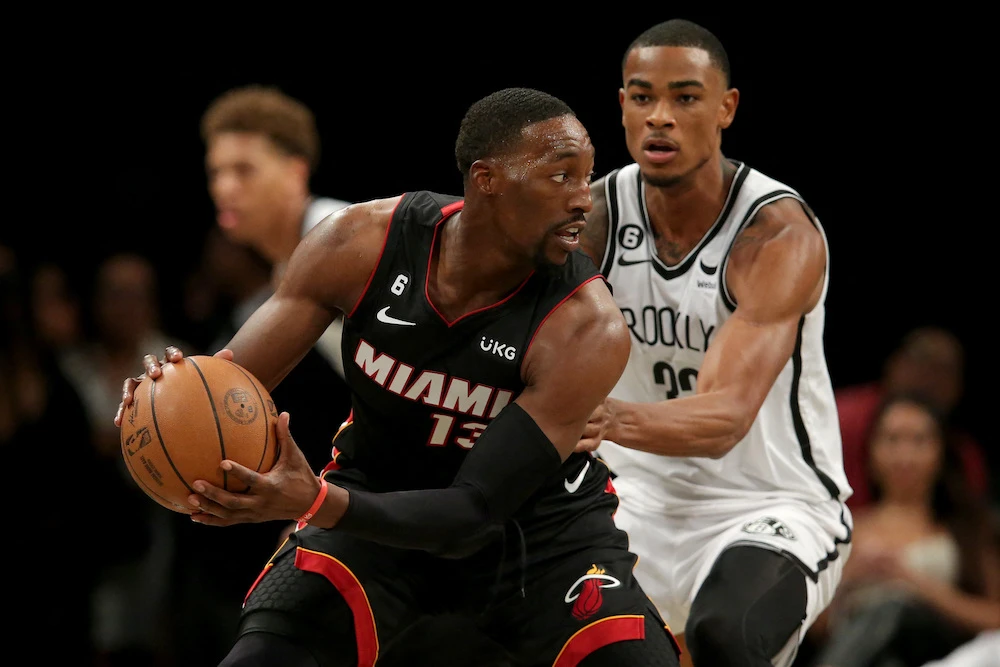 Miami Heat center Bam Adebayo and Brooklyn Nets forward Nic Claxton during the third quarter of an NBA preseason game at Barclays Center Thursday. (USA TODAY Sports)