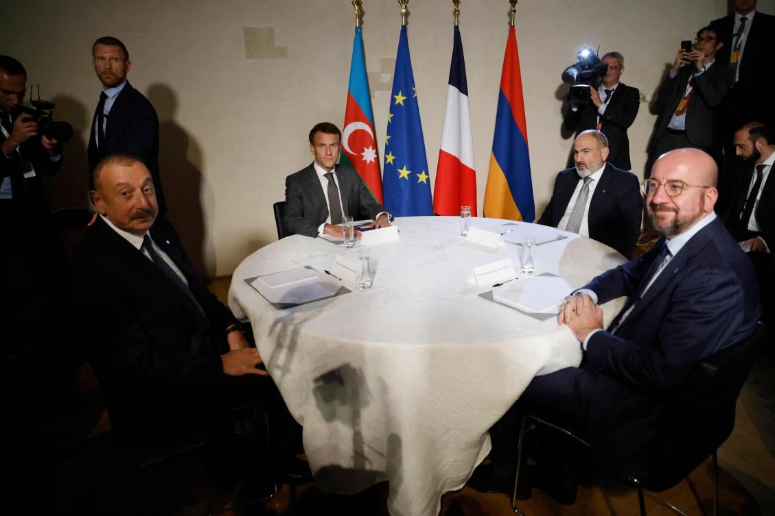 From left: Presidents Ilham Aliyev of Azerbaijan with Emmanuel Macron of France, Armenia’s PM Nikol Pashinyan and President of the European Council Charles Michel meet in Prague on Oct. 6, 2022. (AFP)